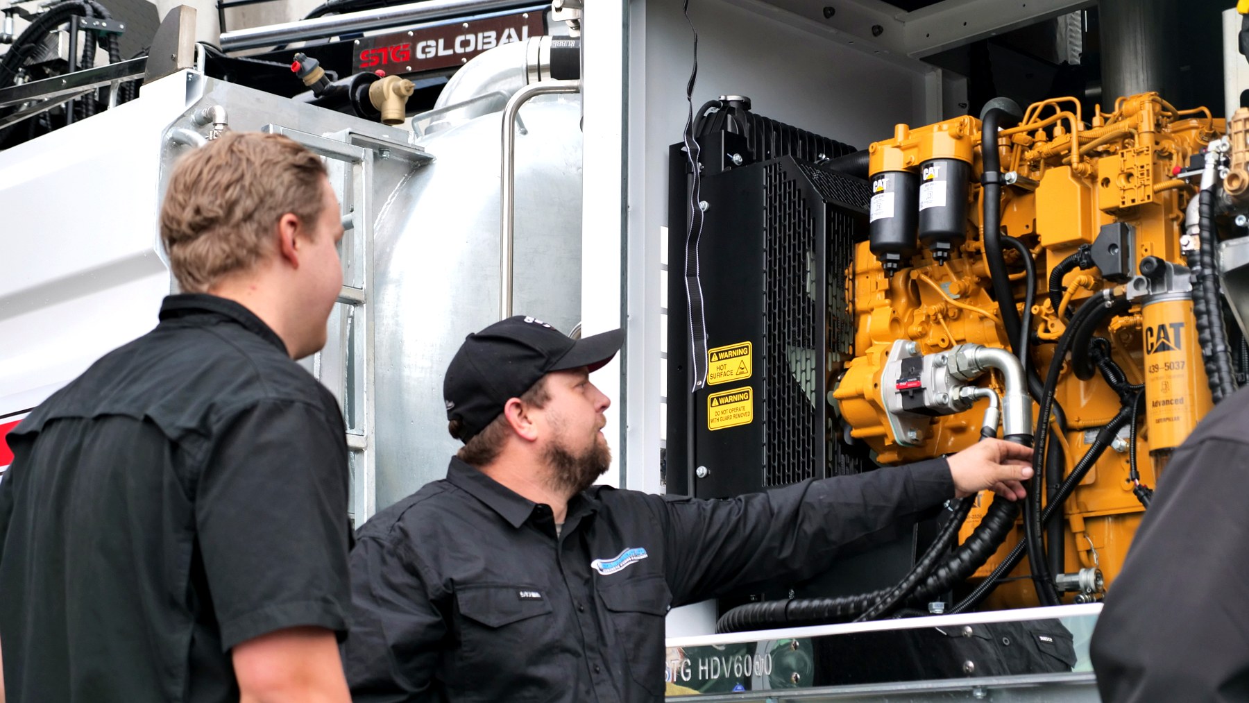 PS Equipment inspecting the CAT power pack on an STG HDV6000 hydro-excavation build
